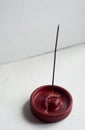 Incense stand red lips. Round shape on a white background. Esotericism, meditation.