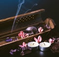 Incense stick aroma with smoke in a wooden handmade holder