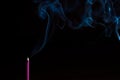 Incense stick on a black background