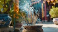 Incense sticks burning in a traditional pot with smoke, at a temple Royalty Free Stock Photo