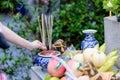 Incenses in variety food, asian belief and tradition to pray for their ancestors, god, angels and spiritual. The hand of woman put Royalty Free Stock Photo