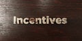 Incentives - grungy wooden headline on Maple - 3D rendered royalty free stock image