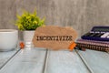 INCENTIVIZE - Hand writing word to represent the meaning of Business word as concept Royalty Free Stock Photo