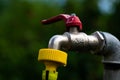 3, 4 inch garden water tap with yellow hose Royalty Free Stock Photo