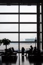 Incheon, South Korea - Aug 14 2016: Incheon International Airport. Silhouette of a passenger with a suitcase.