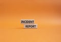 Incident Report symbol. Concept word Incident Report on wooden blocks. Beautiful orange background. Business and Incident Report Royalty Free Stock Photo