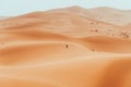 Incidental local berber man wandering through Sahara Desert Merzouga, Morocco