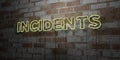 INCIDENTS - Glowing Neon Sign on stonework wall - 3D rendered royalty free stock illustration