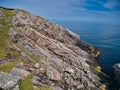 Inclined rock strata near the Eilean Glas Lighthouse on Scalpay - Outer Hebrides Thrust Zone Mylonites Complex - Mylonite. Royalty Free Stock Photo