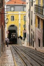 Inclined street in Lisbon and Bica Elevator rails.