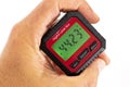 inclinometer, small safe level measuring device between fingers of a hand Royalty Free Stock Photo