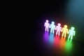 Inclusion, a working group of five multi-colored icons of a human worker on a dark background. team building, cultural diversity,