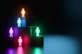 Inclusion, a working group of five multi-colored icons of a human worker on a dark background. team building, cultural diversity,