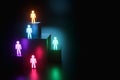 Inclusion, a working group of five multi-colored icons of a human worker on a dark background. team building, cultural diversity,