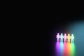 Inclusion, a working group of five multi-colored icons of a human worker on a dark background. team building, cultural diversity,