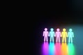 Inclusion, a working group of five multi-colored icons of a human worker on a dark background. team building, cultural diversity,