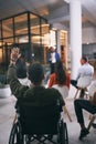 Inclusivity breaks all boundaries. an unrecognizable businessperson raising their hand to ask a question during a Royalty Free Stock Photo