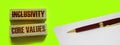 Inclusivity and core values words written on wooden blocks. Social and business concept Royalty Free Stock Photo