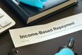 Income Based Repayment IBR documents on a desk. Royalty Free Stock Photo