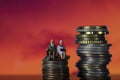 Income Tax Campaign Spain. Old Couple sitting on coin stack.. Declaracion de la Renta. Macro