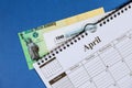 Income tax with form 1040 and spiral calendar April