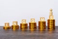 Income text written on wooden block with stacked coins