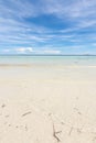 Incoming gentle waves, crystal clear water and white sand at Dumaluan Beach in Panglao, Bohol. Low angle shot