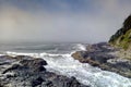 Incoming surf tide churns in narrow channel of Thor`s Well on Cape Perpetua, Oregon coast Royalty Free Stock Photo