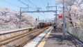 Incoming train at kami katsura station during the spring season in Kyoto, Japan