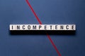 Incompetence - word concept on cubes