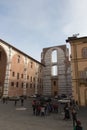 Incomplete facade of the planned Duomo nuovo and people on a square in front of it. Facciatone. Siena. Tuscany Italy. Royalty Free Stock Photo