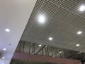 Incomplete Gypsum and macro grid ceiling under progress in an Shopping mall due to snag list Royalty Free Stock Photo