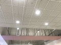 Incomplete Gypsum and macro grid ceiling under progress in an Shopping mall due to snag list Royalty Free Stock Photo