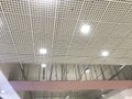 Incomplete Gypsum and macro grid ceiling under progress in an Shopping mall due to snag list Royalty Free Stock Photo