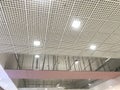 Incomplete Gypsum and macro grid ceiling under progress in an Shopping mall due to snag list Royalty Free Stock Photo