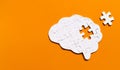 Incomplete Human Brain Puzzle on Orange Royalty Free Stock Photo