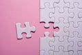 Incomplete white jigsaw puzzle pieces on pink background Royalty Free Stock Photo