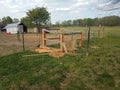 Incomplete wooden sheep shed structure on farm