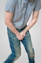 Incontinence concept. Man wants to pee and is holding his bladder Royalty Free Stock Photo