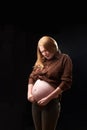 The inconvenience of pregnancy. a pregnant woman can`t fasten her pants. gravity of movements of the pregnant woman