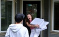 failed pizza delivery delivery guy threw three untitled boxes with white space for text ad to girl near door she caught Royalty Free Stock Photo