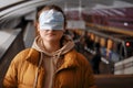 Incorrectly put on a mask on a woman in public transport among people