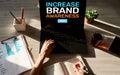 Increase brand awareness text on screen. Advertising and marketing concept Royalty Free Stock Photo