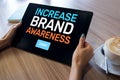 Increase brand awareness text on screen. Advertising and marketing concept. Royalty Free Stock Photo