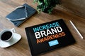 Increase brand awareness text on screen. Advertising and marketing concept. Royalty Free Stock Photo