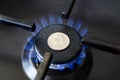 Increase in the cost of the gas bill - Quarter dollar coin and gas stove turned on