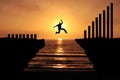 Increase earning and productivity By taking a big risk. Silhouette of a business man jumping over the cliff to attempt More profit Royalty Free Stock Photo