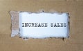 Increase sales inscription words on paper on table Royalty Free Stock Photo