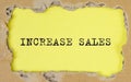 Increase sales inscription words on paper on table Royalty Free Stock Photo