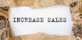 Increase sales inscription words on paper on table Royalty Free Stock Photo